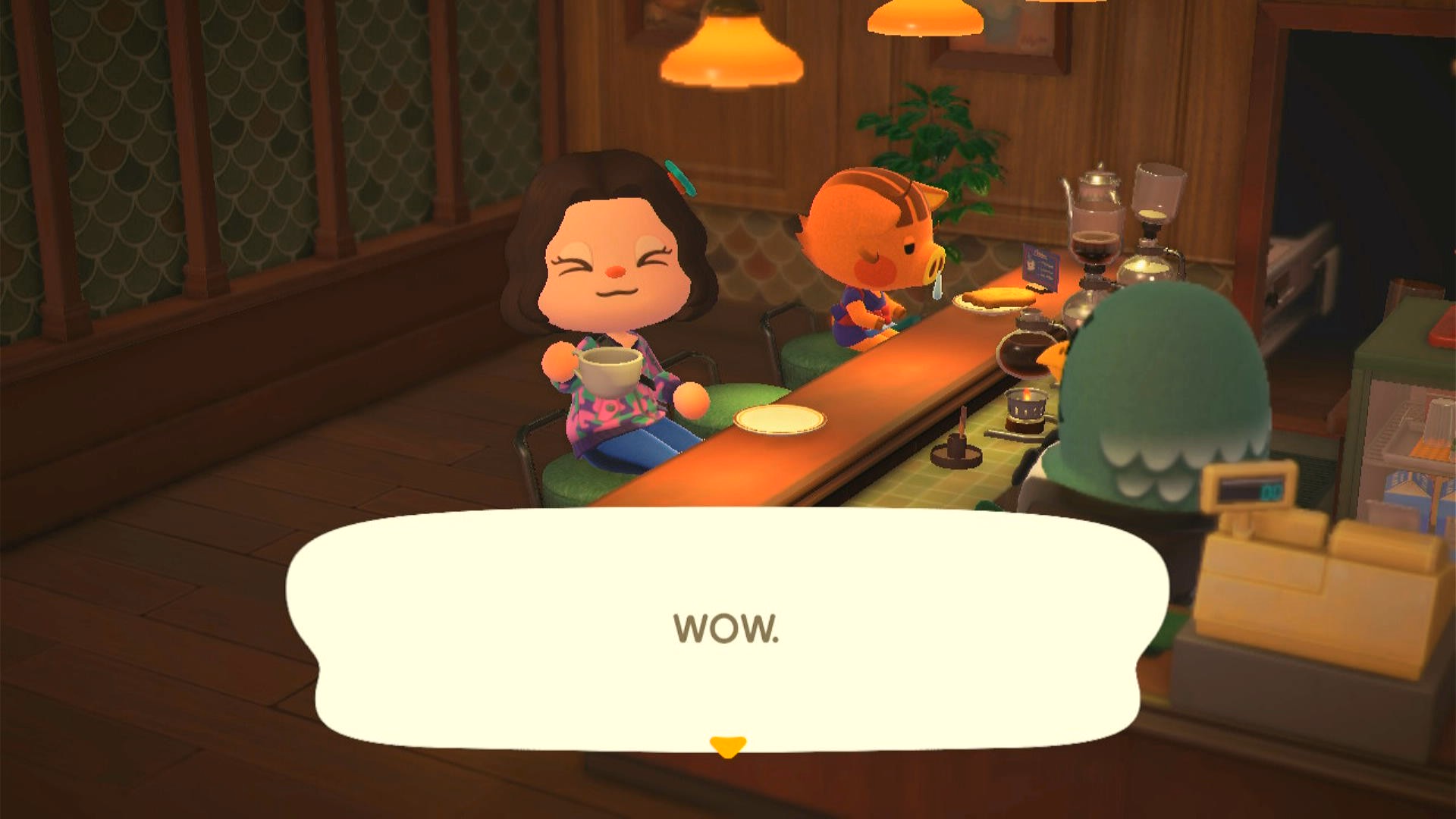 A player enjoys a cup of coffe in The Roost with Daisy Mae sitting near them.